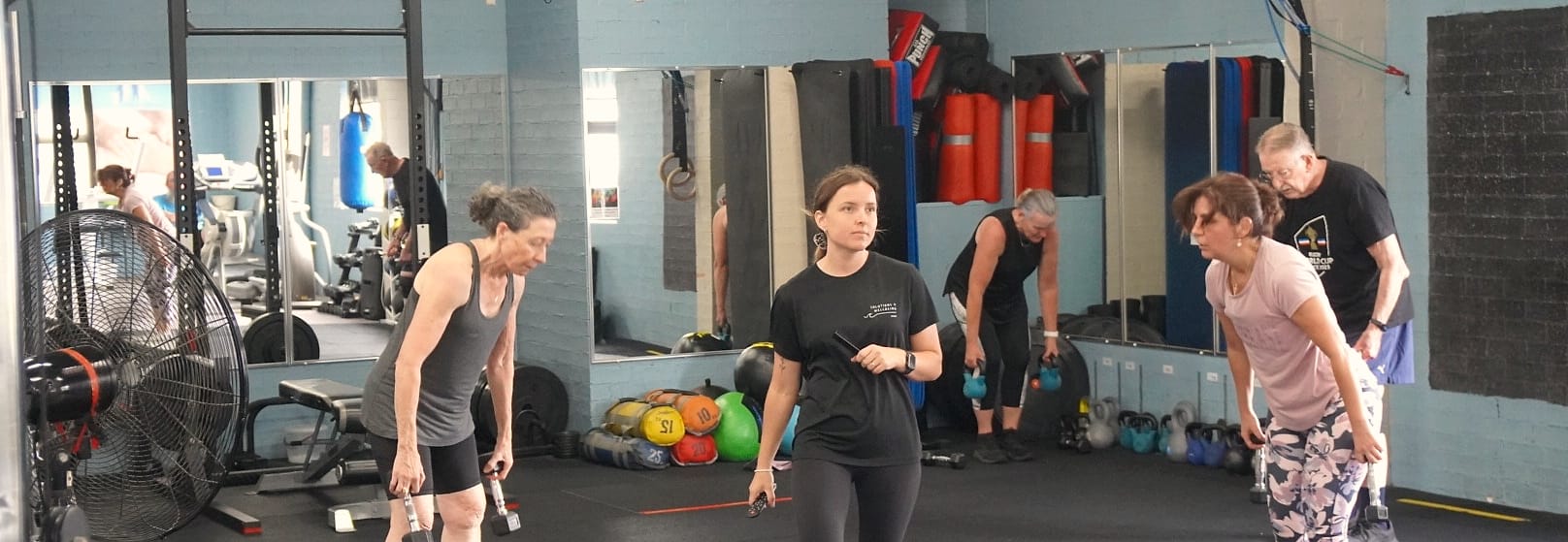 Members working through a strength session in the rehabilitation gym