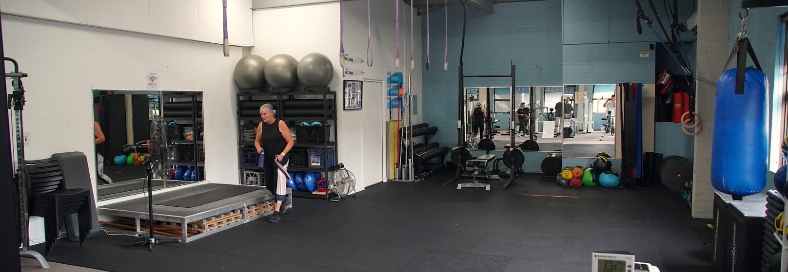 The rehabilitation gym floor, with weights, a training rig and Swiss balls